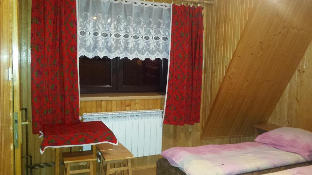 Posteľ alebo postele v izbe v ubytovaní Pokoje Zakopane