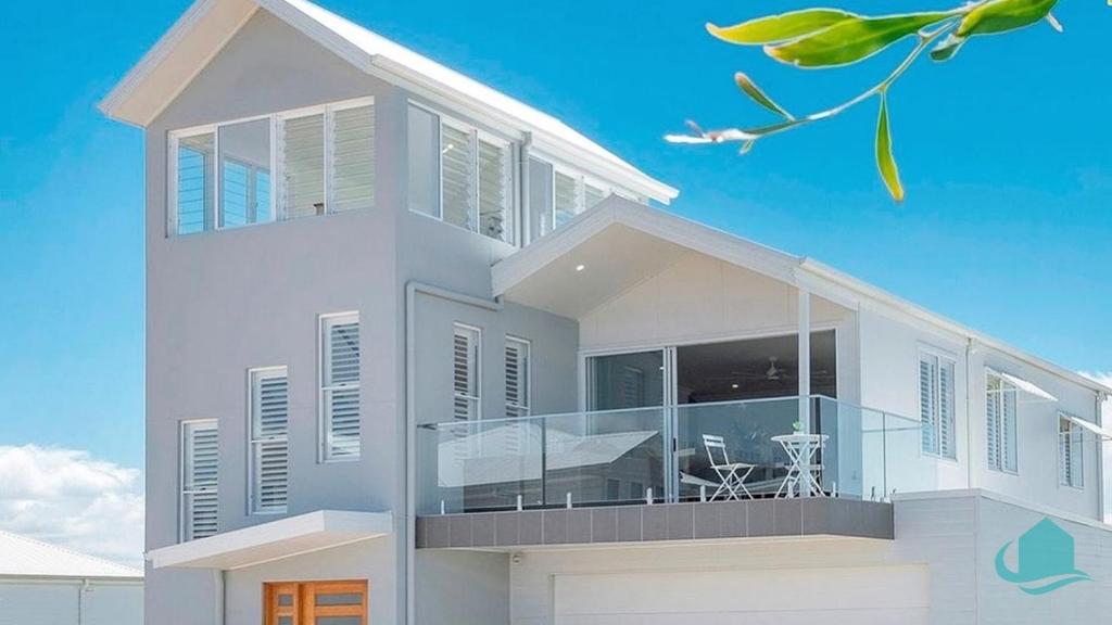 a rendering of a white house with glass at Beachside Oasis in Caves Beach
