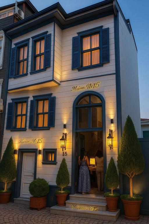 two people standing in the doorway of a house at Abelia Mansion Hotel in Istanbul
