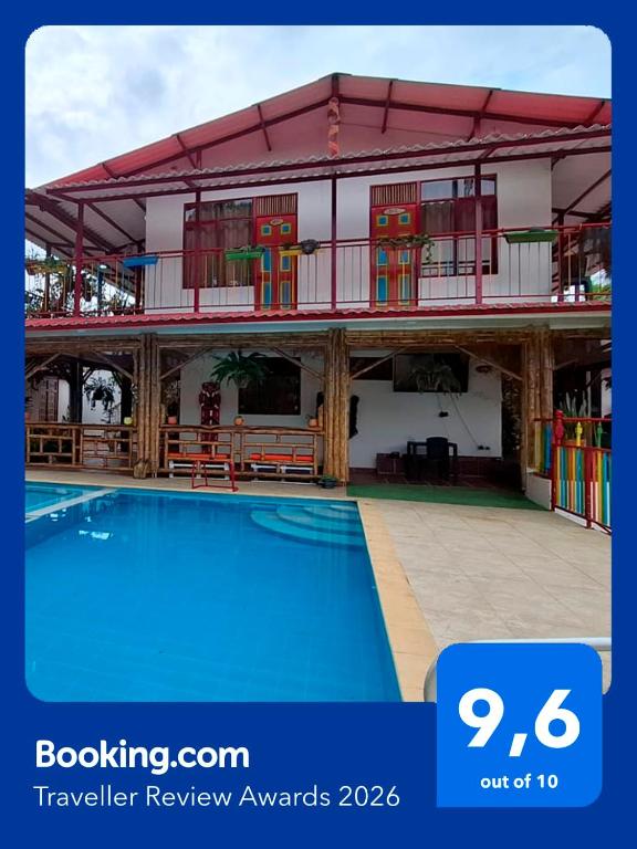 a view of a building with a swimming pool at New Paradise Nueva Sede - La Vega Cundinamarca -Avistamiento de aves in La Vega