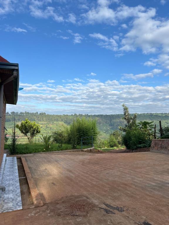an empty parking lot with a view of a field at Ikamba Residence in Rwamagana