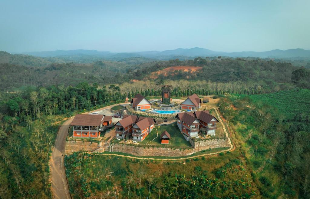 an aerial view of a house on a hill at Hill Seasons Resorts and SPA in Tindummal