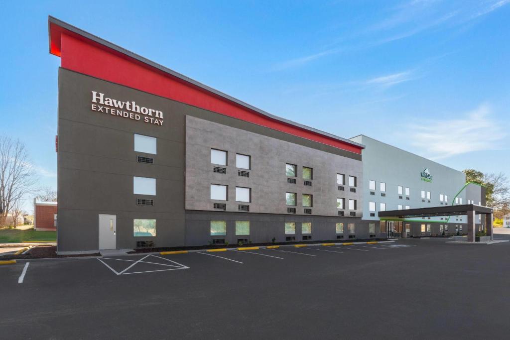 a rendering of a hospital building with a parking lot at Hawthorn Extended Stay by Wyndham Jackson in Jackson