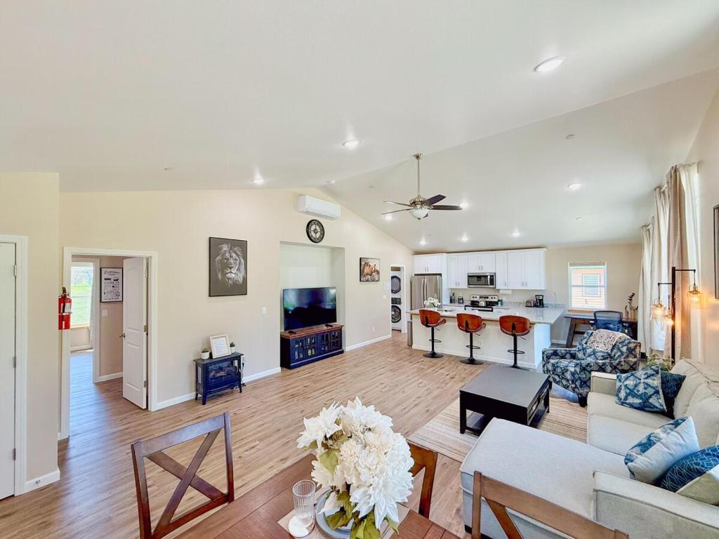 a living room with a couch and a table at Family-Friendly Yosemite Nest in Mariposa