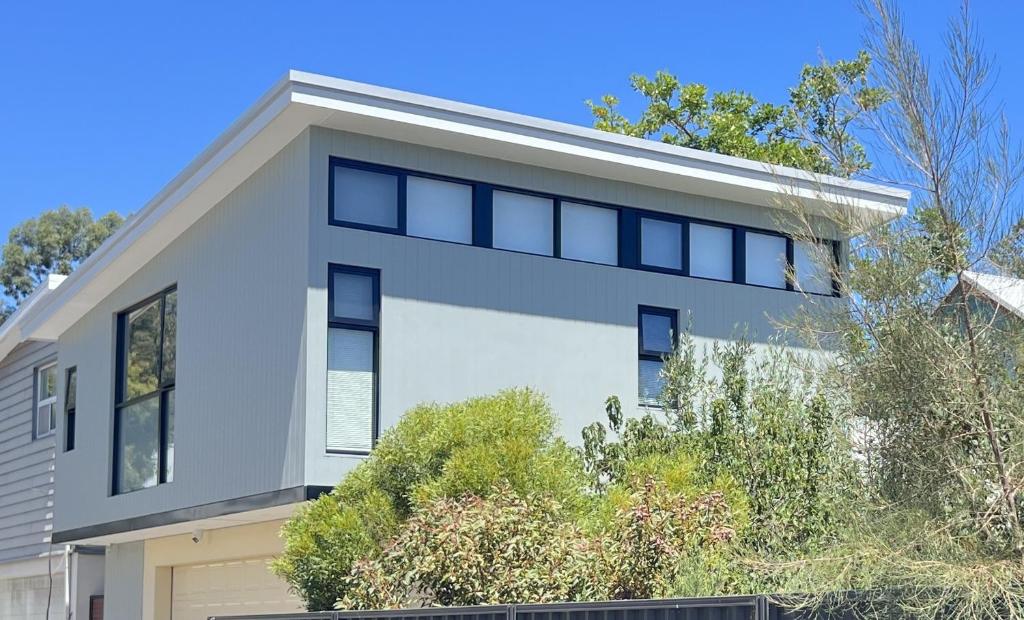 an image of a white house at il Villinno on Dalton - Great Location in Mosman Park