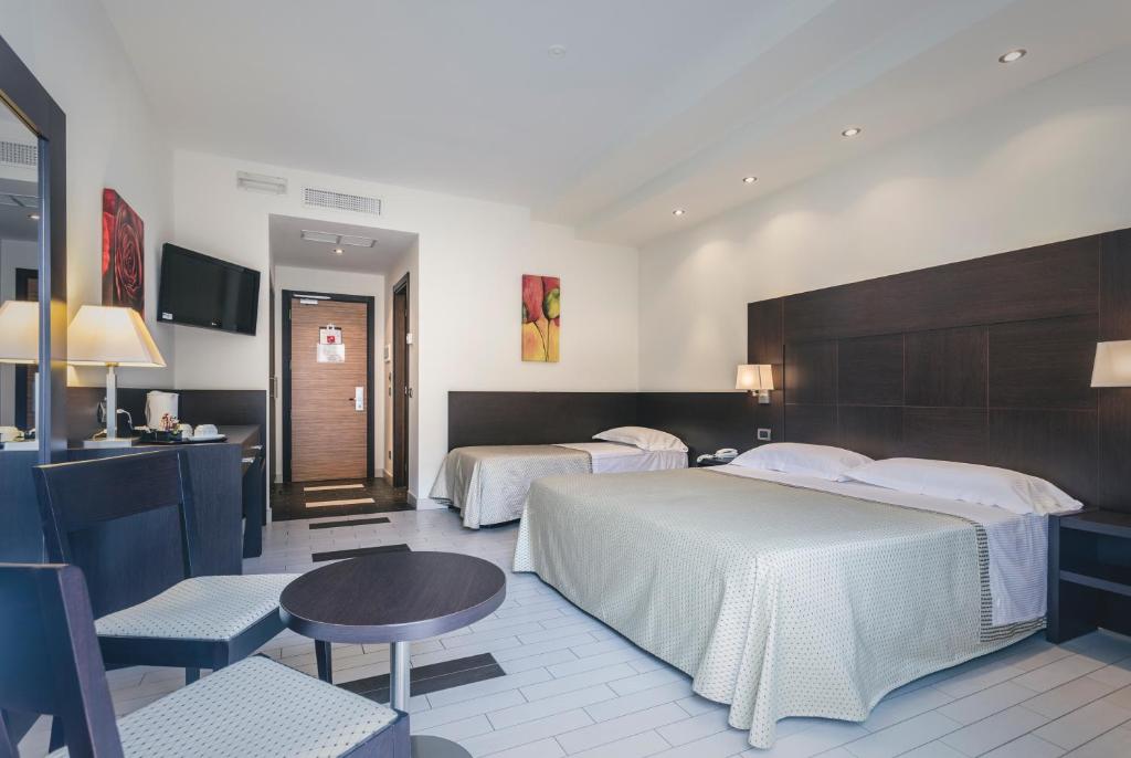 Postel nebo postele na pokoji v ubytování Hotel Principe Residence