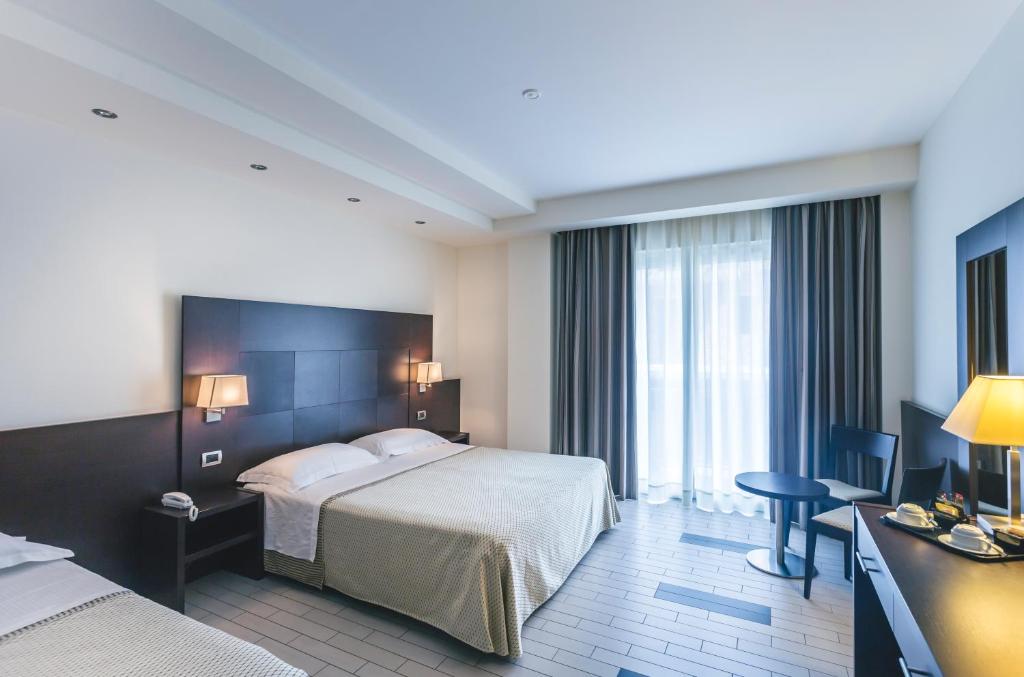 Postel nebo postele na pokoji v ubytování Hotel Principe Residence