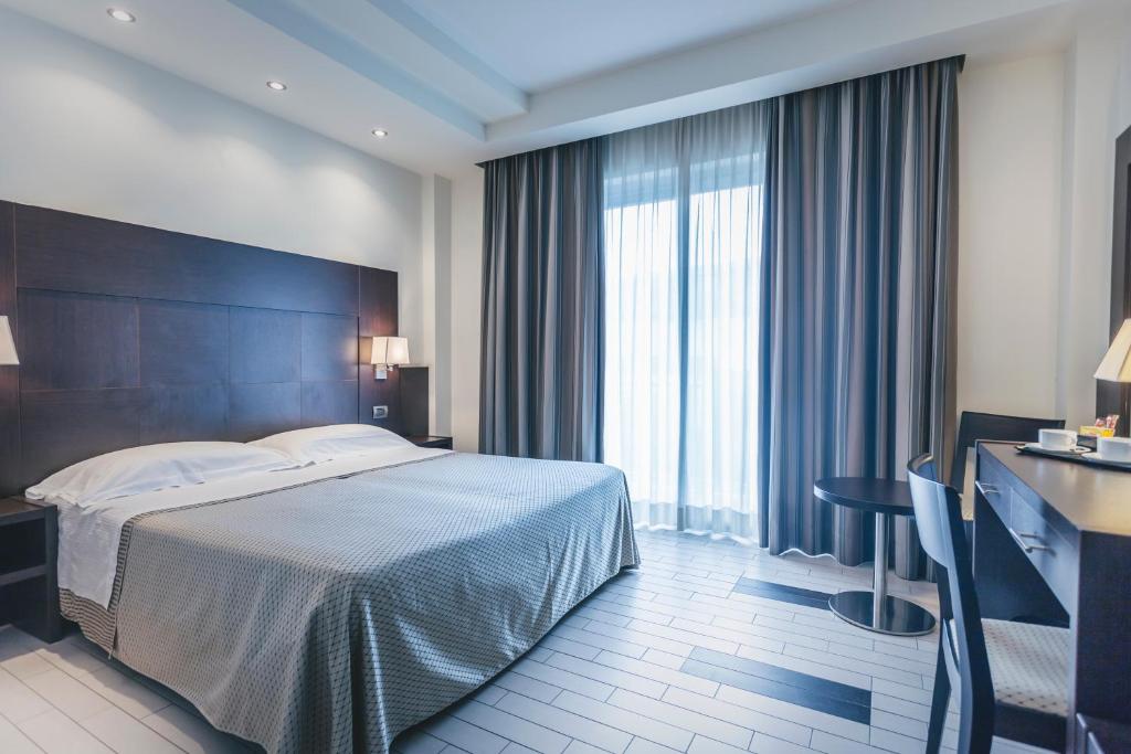 Postel nebo postele na pokoji v ubytování Hotel Principe Residence