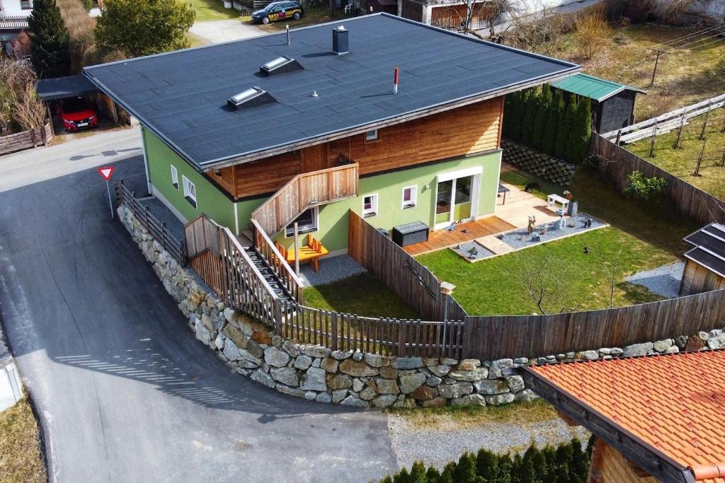 an overhead view of a house with a stone wall at Freestyle Apartment in Sautens