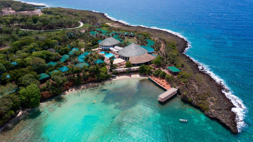 an aerial view of a resort on an island in the ocean at Hotel Roatán Media Luna Resort, Affiliated by Meliá in First Bight