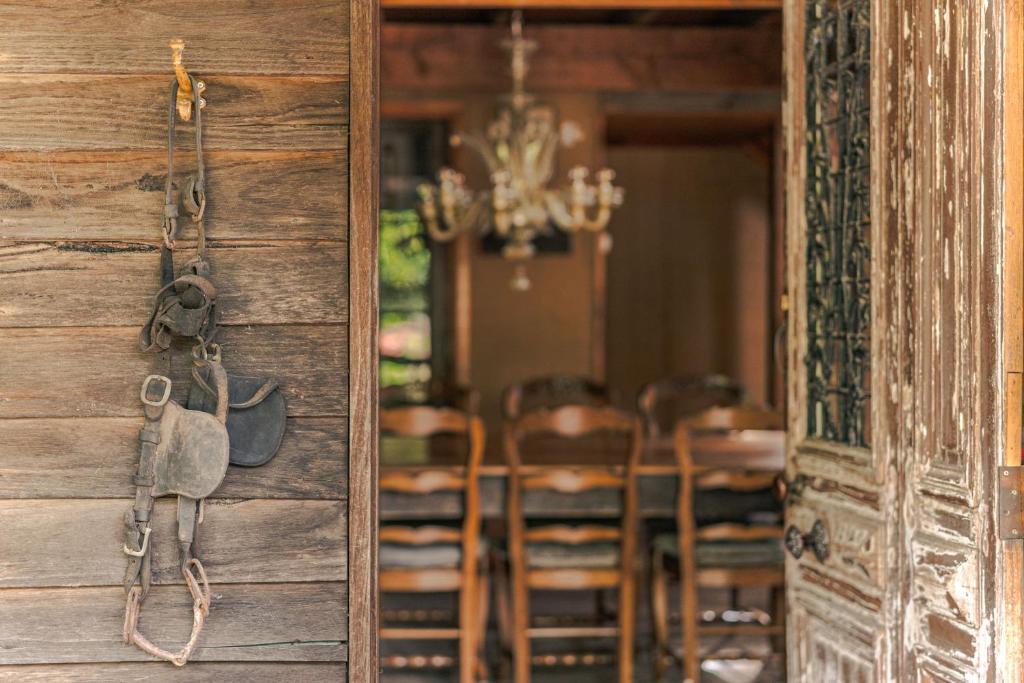 a room with a table and chairs and a door at The Barn Daylesford in Daylesford