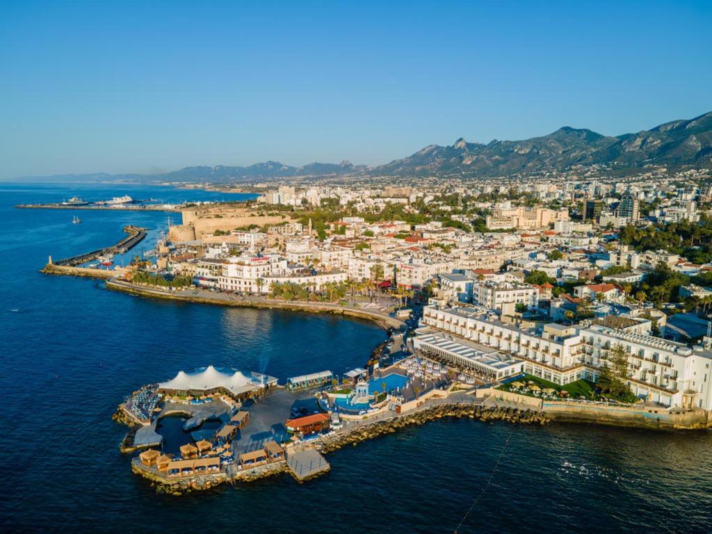 an aerial view of a town on the water at Dome Hotel in Kyrenia