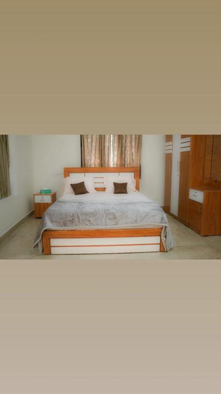 a bedroom with a large bed in a room at Haven Grace in Kovalam