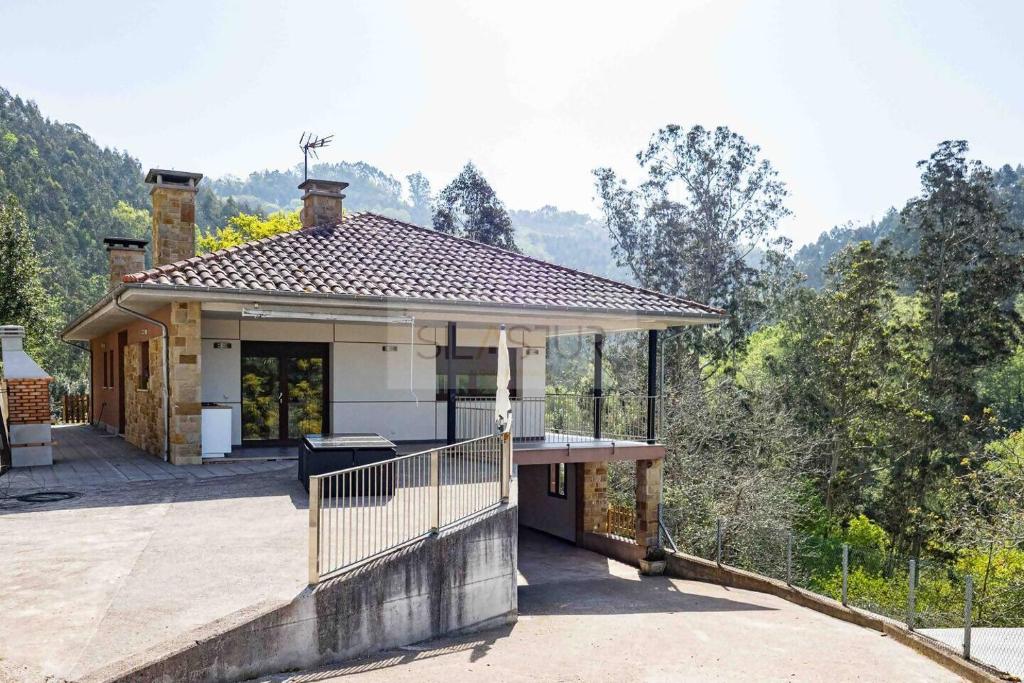 a house with a porch with a roof at Pomar By Silastur in Obaya