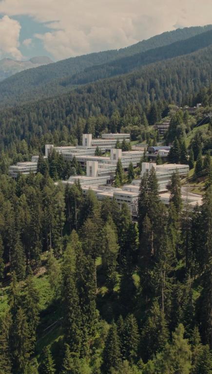 an aerial view of a large building in a forest at Residenza Albaré in Marilleva