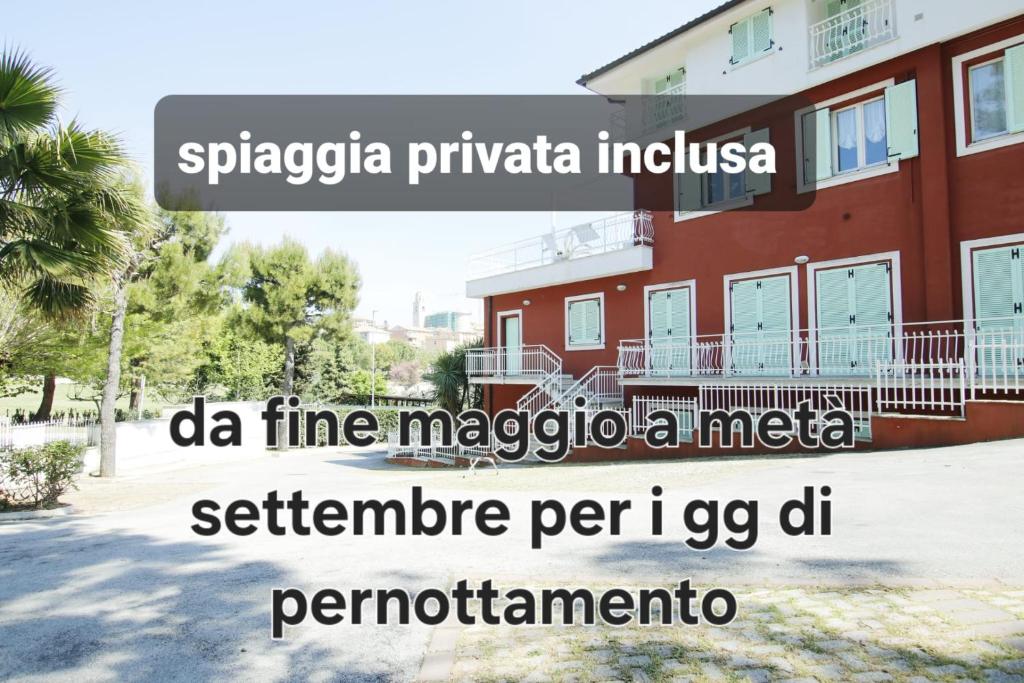 a building with the words spigeria privateica indica da fine magico at Appartamenti I Principi del Conero 2 in Sirolo