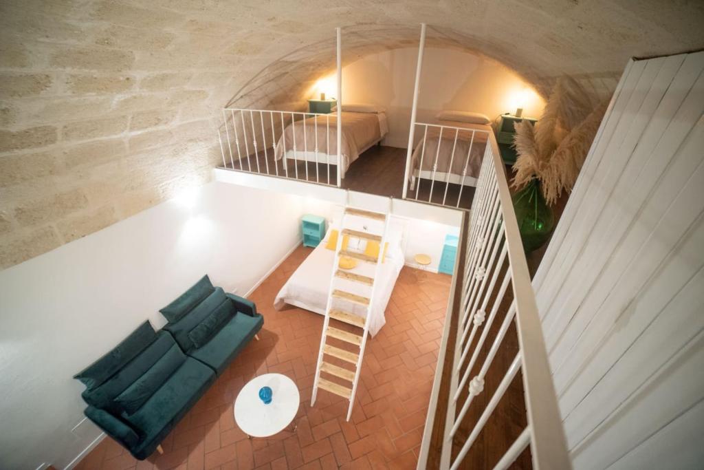 an overhead view of a living room with a couch and stairs at Vecchia Mottola Albergo Diffuso in Mottola