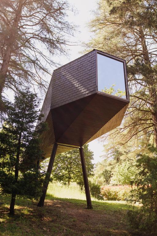 a sculpture in a park with trees in the background at Pedras Salgadas Spa & Nature Park in Pedras Salgadas
