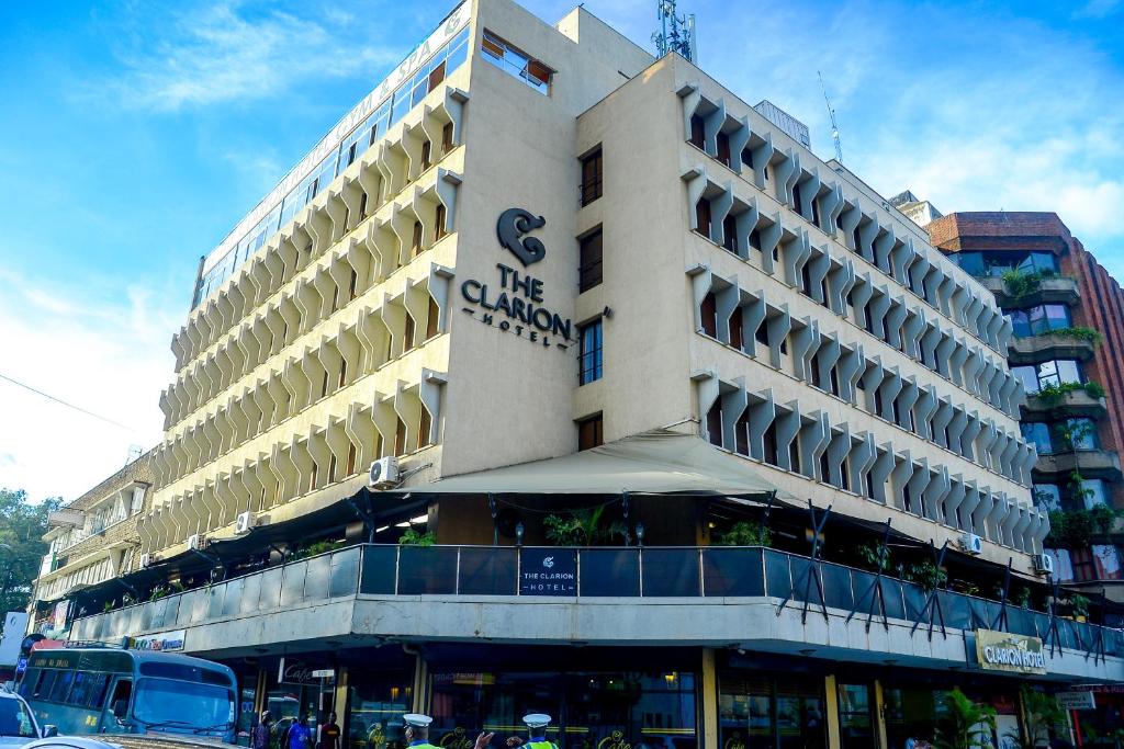 a large building with a sign on the side of it at Clarion Hotel Nairobi in Nairobi