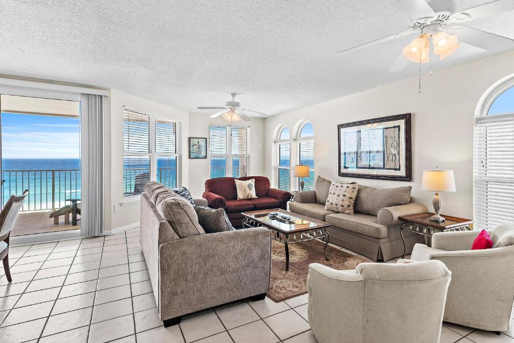 a living room with a view of the ocean at The Palms #601 in Fort Walton Beach