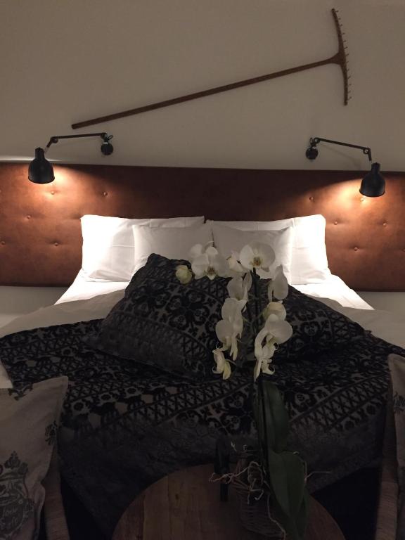 Postel nebo postele na pokoji v ubytování Hotel Mezzo