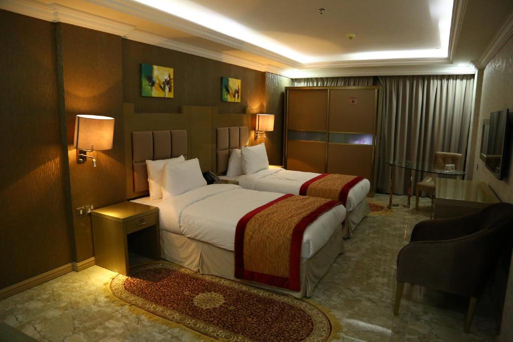 Postel nebo postele na pokoji v ubytování Sun and Sands Plaza Hotel