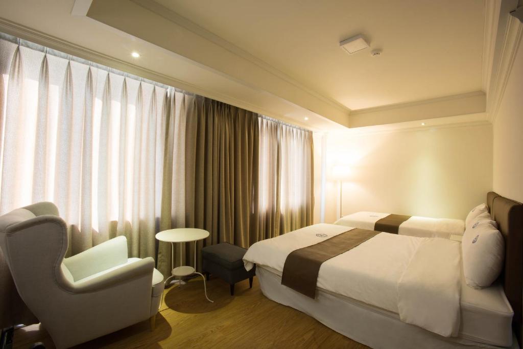 Postel nebo postele na pokoji v ubytování Hillside Hotel