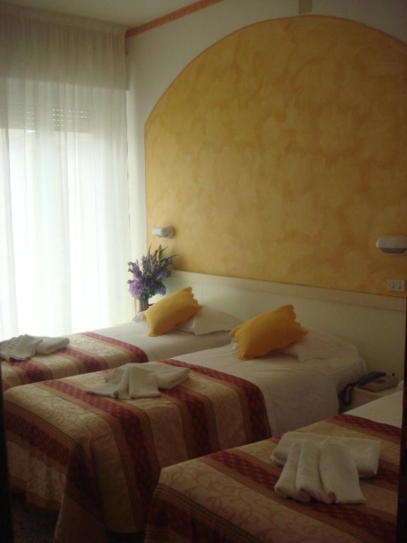 Postel nebo postele na pokoji v ubytování Hotel Arcade