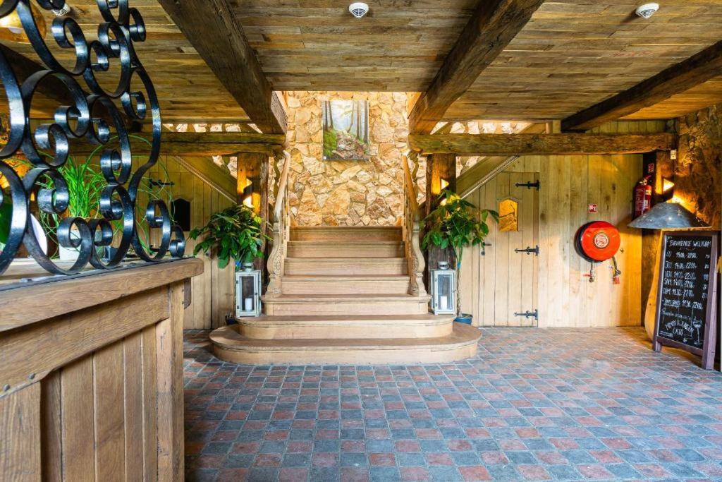 a hallway with a staircase in a building at lignely in Durbuy