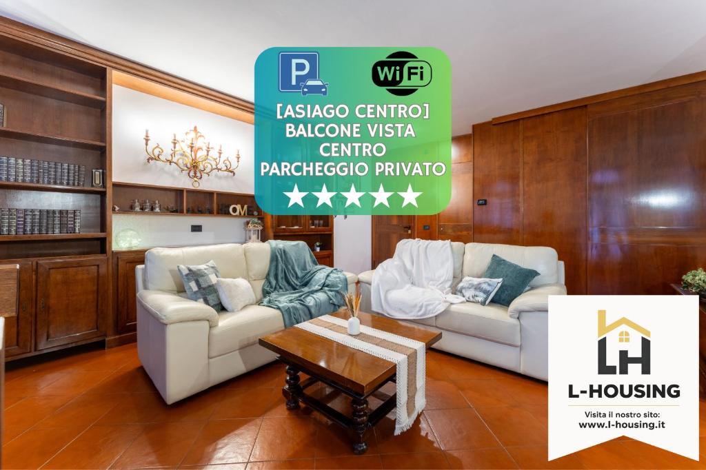 a living room with two couches and a table at Fuori da ZTL - Asiago a due passi da tutto in Asiago