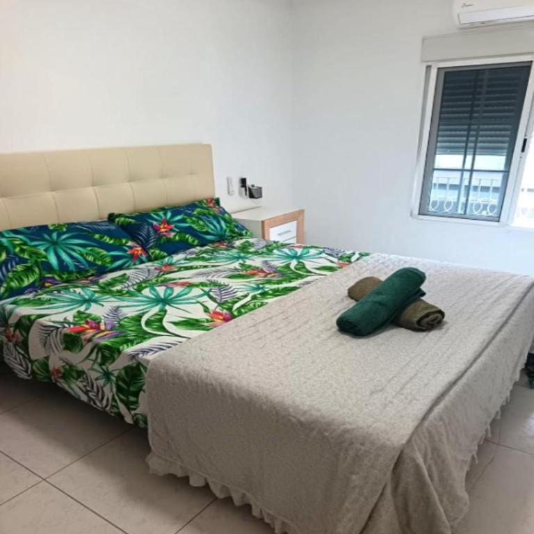 a bedroom with a bed with a teddy bear on it at San Jose Luminoso in Algemesí