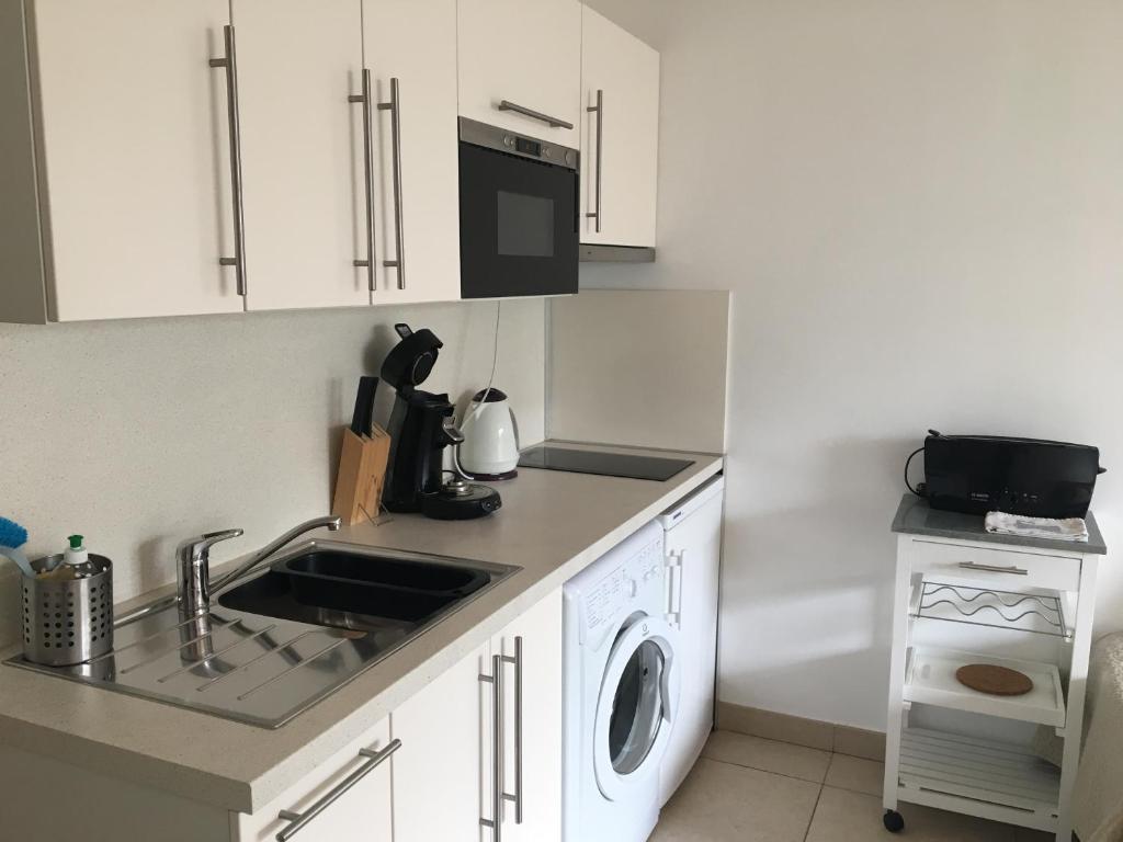 Kuchyň nebo kuchyňský kout v ubytování Residence Gameau