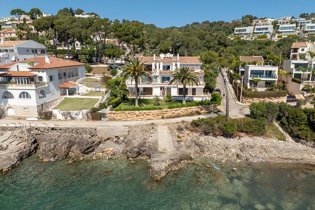 an aerial view of a house next to the water at Apartment Vida Sana by Sealand Villas in Alcudia