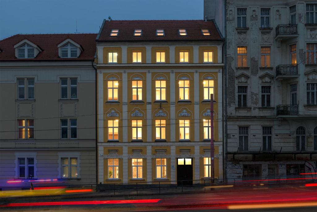 a tall building with its lights on at Villa Šanca in Bratislava