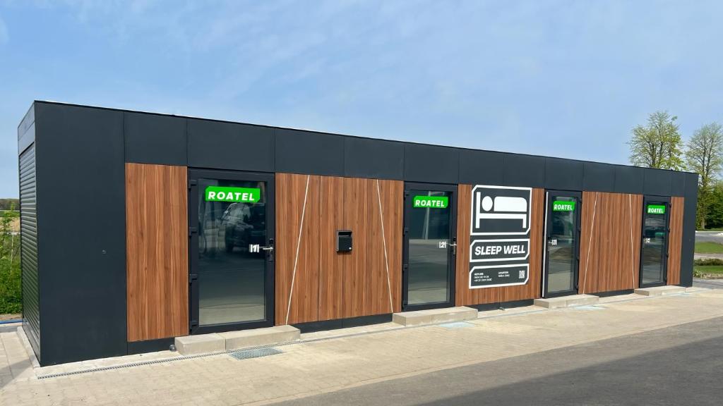 a building with a row of doors and windows at Roatel Willich A44 my-roatel-com in Willich