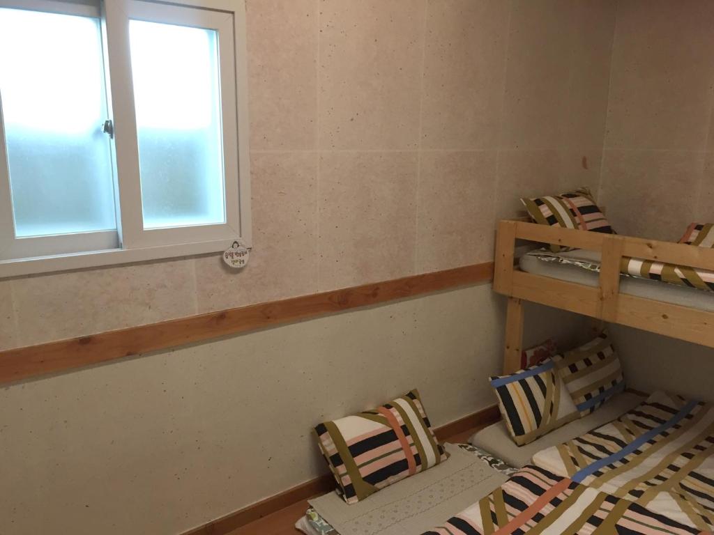 Postel nebo postele na pokoji v ubytování Dorandoran Guesthouse