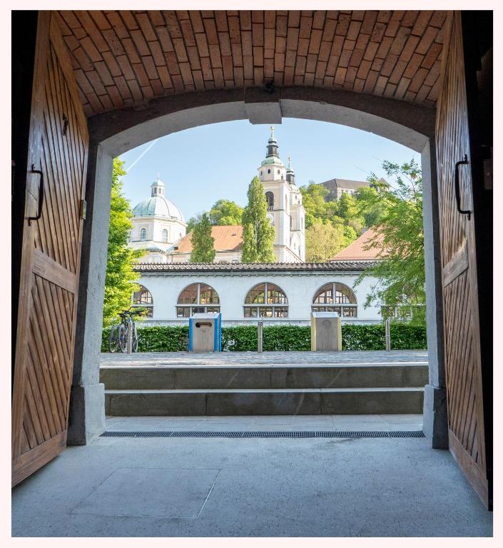 a view through an open door of a building at The 1826 Residence in Ljubljana