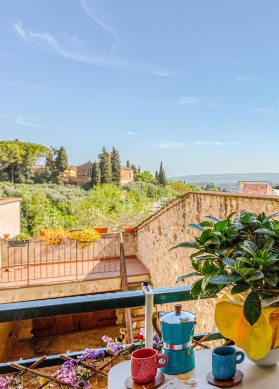 a view from the balcony of a house with a view at Tuscan Treasure Tower in Colle di Val d'Elsa