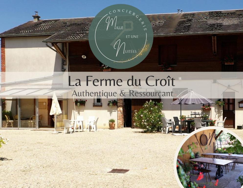 a sign for a restaurant in front of a building at La Ferme du Croît - Proche Lacs & Observatoires in Villehardouin