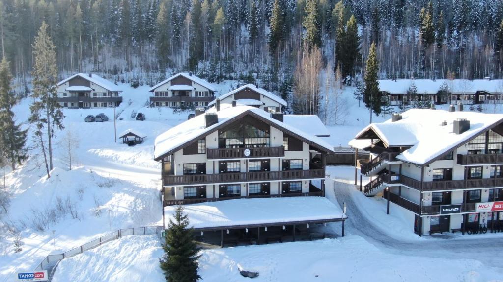 an aerial view of a resort in the snow at Tahko Huoneistohotelli A in Tahkovuori