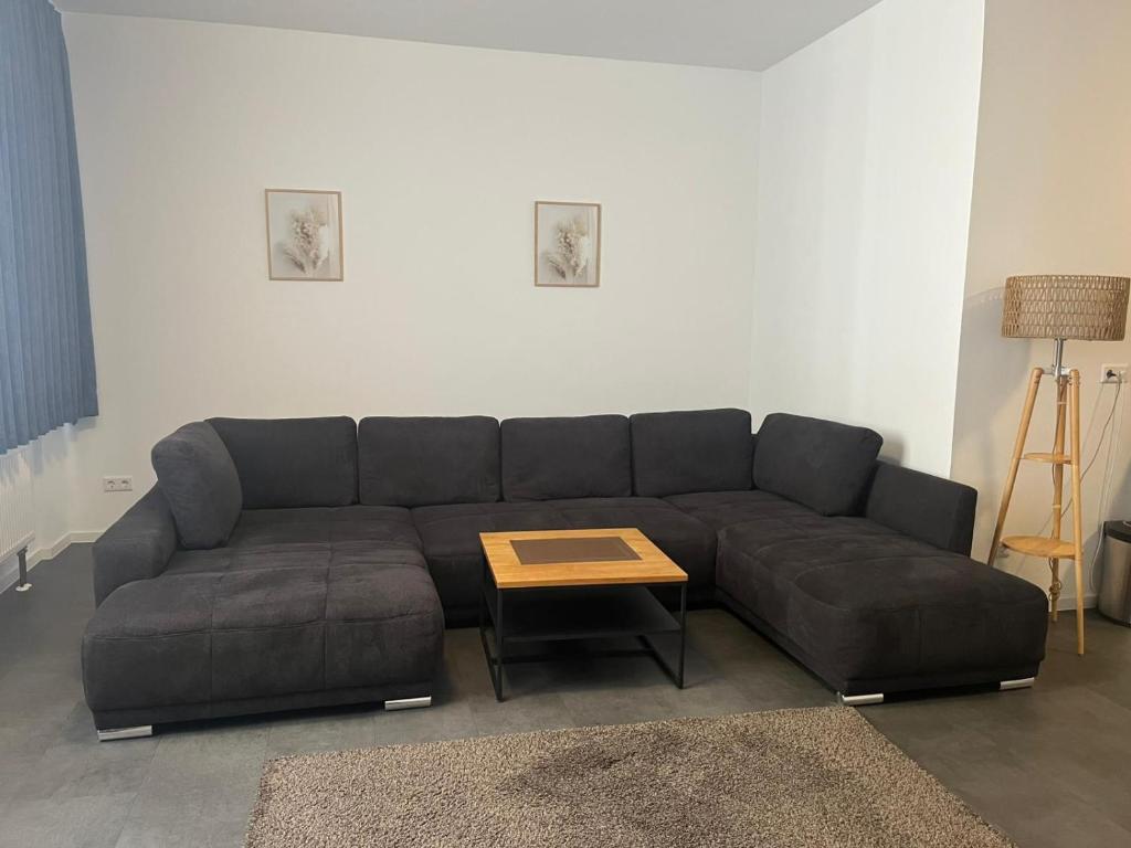 a living room with a couch and a coffee table at Ferienwohnung Alina in Werne an der Lippe