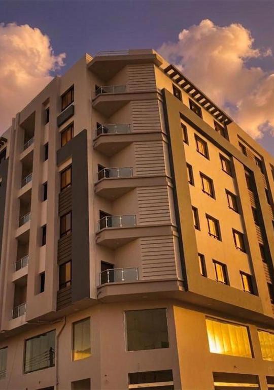 a tall building with balconies on top of it at RED Gardenia in Salalah