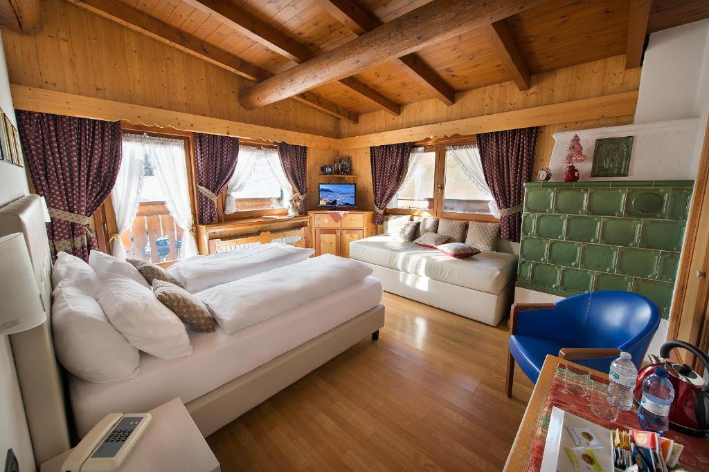 Postel nebo postele na pokoji v ubytování Hotel Posta