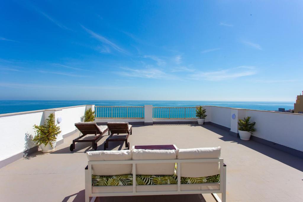 a balcony with a view of the ocean at Lighthouse Cullera Penthouse in Cullera