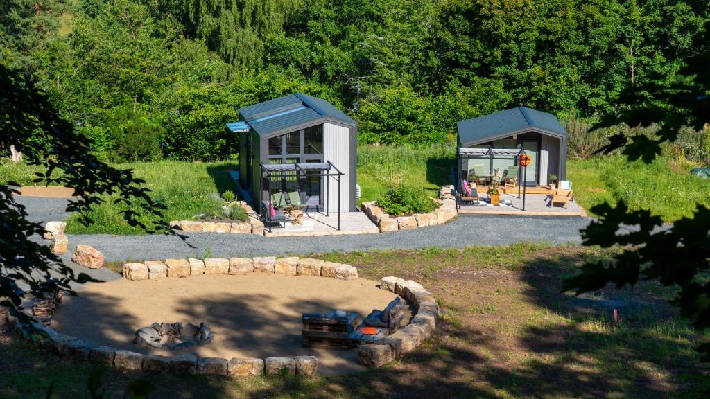 a park with a toy truck in front of a building at Bell-Tiny Homes in Steinau an der Straße