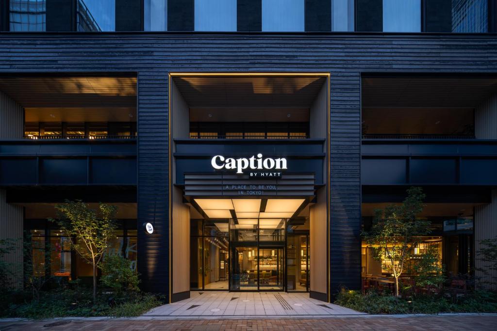 an office building with a sign on the front of it at Caption By Hyatt Kabutocho Tokyo in Tokyo