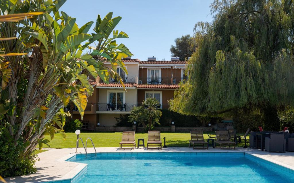 a resort with a swimming pool and a house at Megusta Apartments Selianitika - Poolside Escape in Selianitika