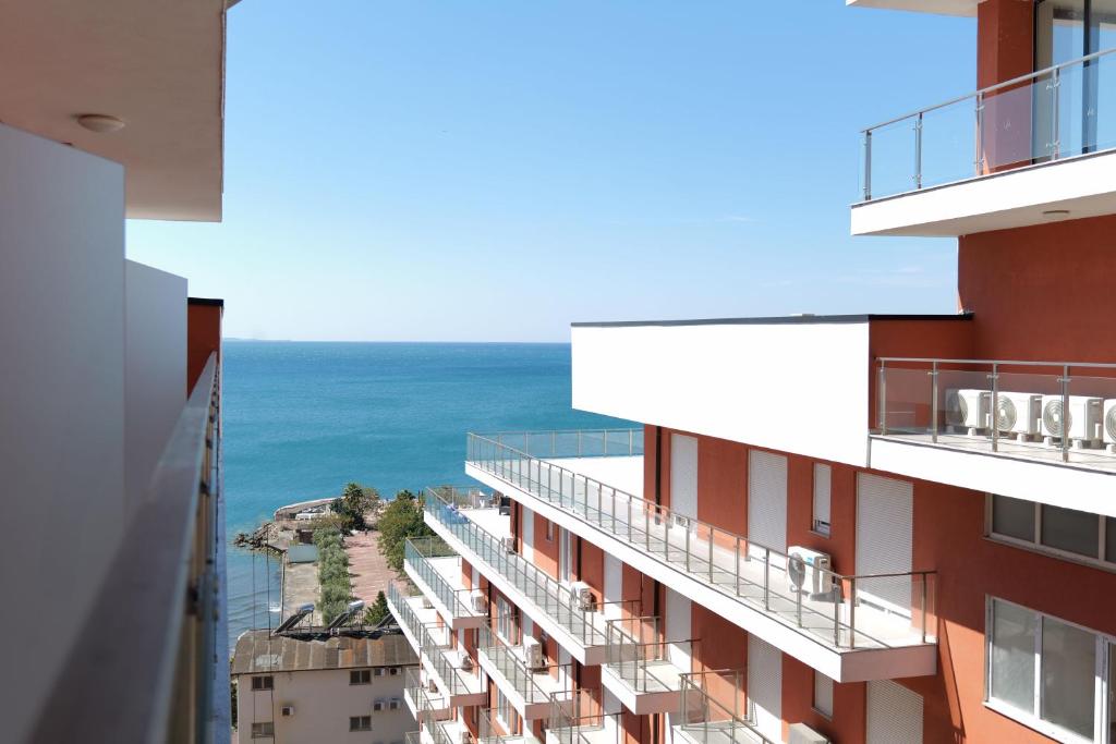a view of the ocean from the balcony of a building at Hotel Sea View Shëngjin in Lezhë