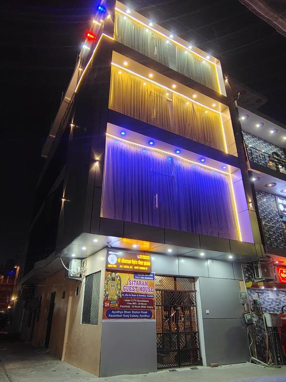 a building with lights on top of it at night at Shri Sitaram Guest House in Ayodhya