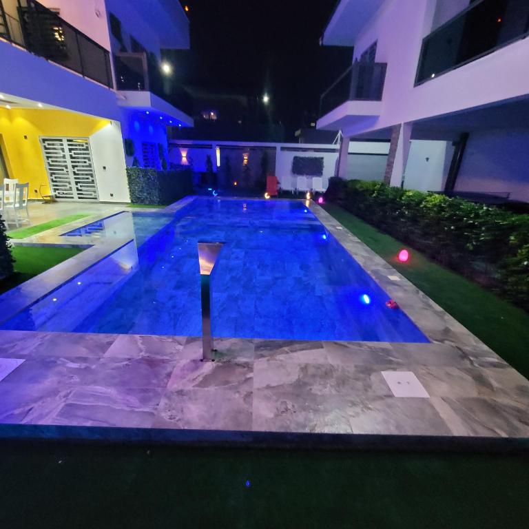 a swimming pool in the middle of a building at night at Villa burj in Ngaparou